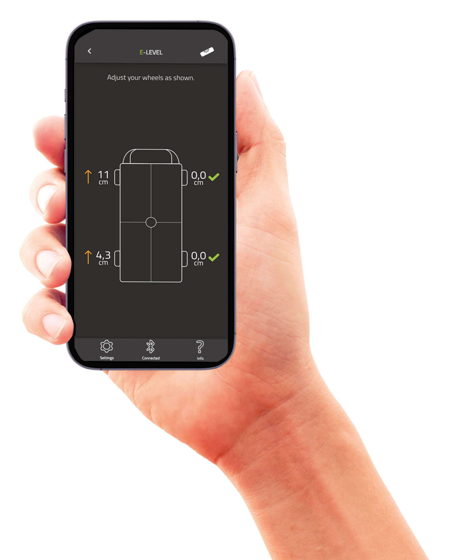 Eine Hand zeigt ein Smartphone mit der E-Trailer App. Darauf das Ausnivellieren eines Campers.